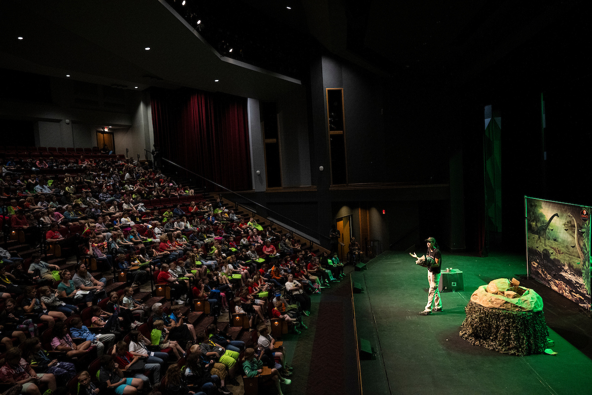 Dino Exhibit during May the 14th Event in Leach Theatre with many elementary kids watching.